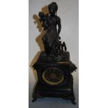 A late 19th century black slate cased mantel clock having enamel dial with gilt Roman numerals and