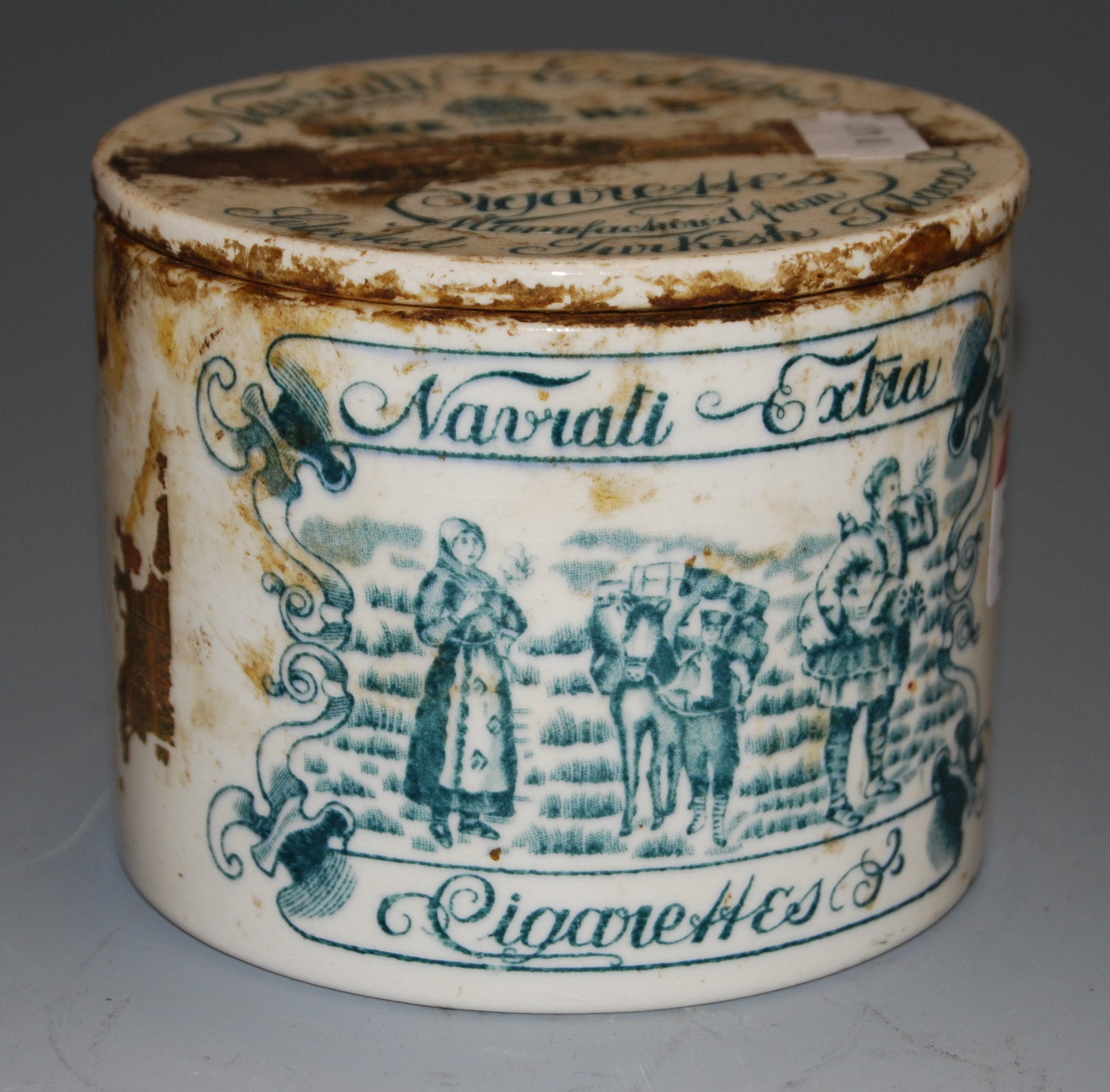 A Victorian Staffordshire tobacco jar and cover, advertising Navratti Extra cigarettes, chip to