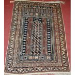 A Persian woollen rug, having boxed reserves and kelim flatweave ends; together with a vintage tan