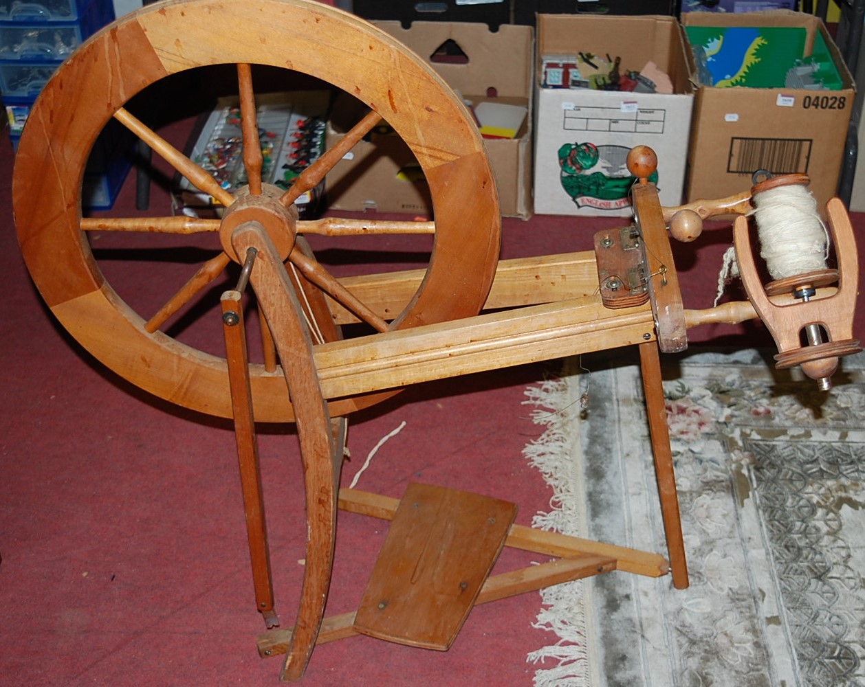 A contemporary beech spinning wheel