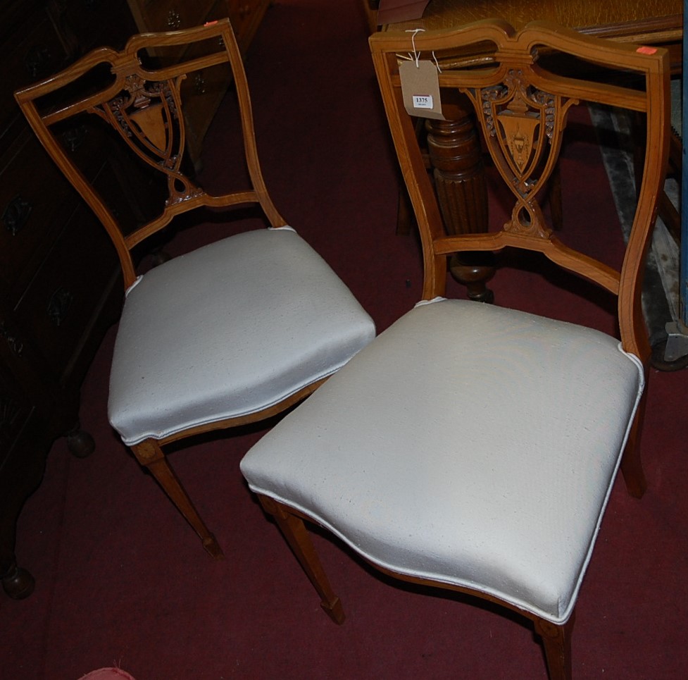 Two pairs of Edwardian satinwood salon chairs, each with white upholstered stuffover seats