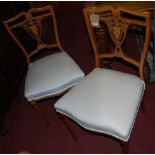 Two pairs of Edwardian satinwood salon chairs, each with white upholstered stuffover seats