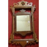 A small 19th century fret carved wall mirror, together with a further fret carved wall mirror (frame