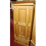 A modern pine single door wardrobe, having single long lower drawer, width 93.5cm