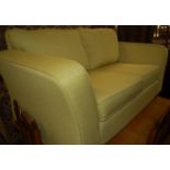 A contemporary Marks & Spencer lime green upholstered two-seater sofa, w.168cm