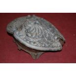 A Baroque style painted cast iron hinged top coal-box in the form of a clam shell