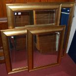 Four various matching contemporary gilt framed bevelled rectangular wall mirrors