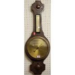 A 1930s oak two dial aneroid wheel barometer