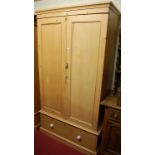 A reclaimed pine double door wardrobe, having single long lower drawer, width 106cm