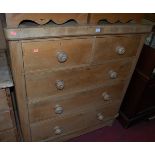 A Victorian pine round cornered chest of two short over three long drawers with turned knob handles,