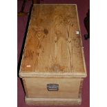 A circa 1900 pine hinged top tool chest, having iron end carry handles, w.90.5cm