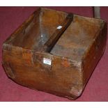 An Eastern stained wood and metal bound grain trough, width 34.5cm