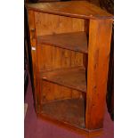 A stained pine hanging open corner shelf, height 104.5cm