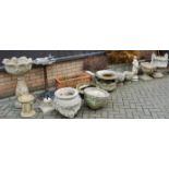 A quantity of various reconstituted stone garden planters of different sizes, together with a