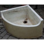 A late Victorian Doulton & Co of Lambeth glazed stoneware garden corner sink, 60x60cm