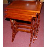 A reproduction yew wood nest of three occasional tables, the largest w.53cm