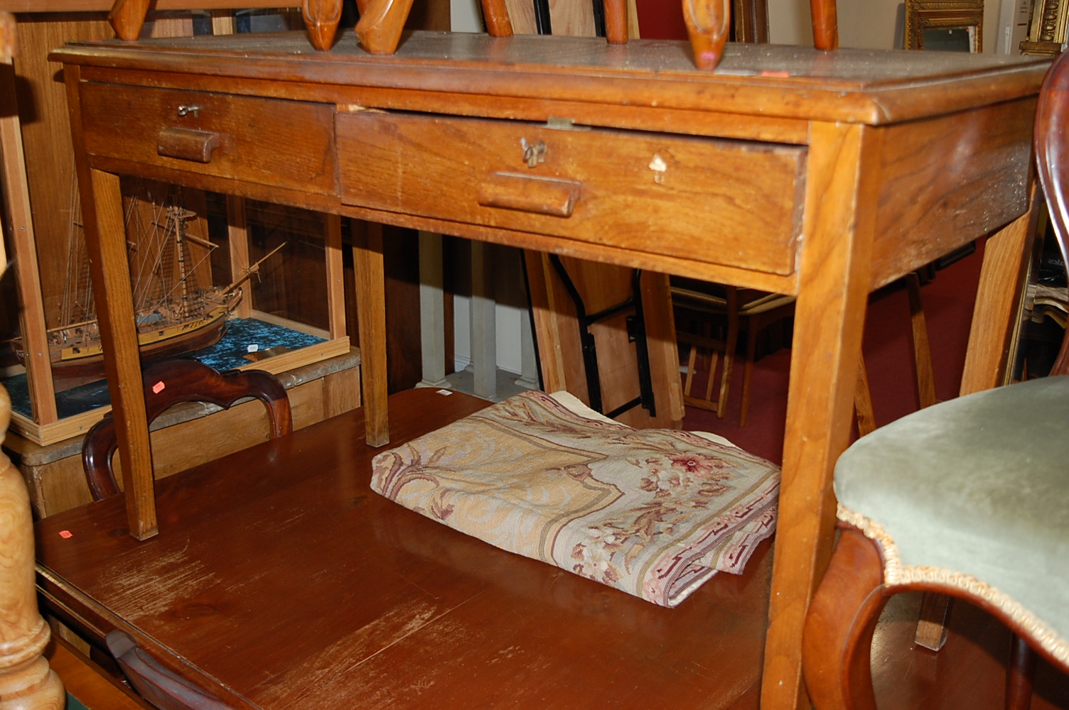 A 1930s oak two drawer side table, w.122cm