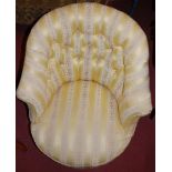 A mid-Victorian mahogany framed and floral striped silk damask button back upholstered tub armchair