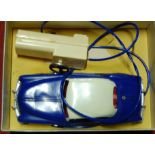 A Marx Toys battery operated electrical car comprising of blue and white body with red interior