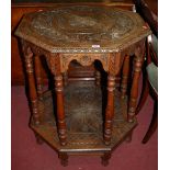 A circa 1900 carved oak two-tier occasional table