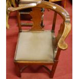 An early 19th century mahogany splatback corner elbow chair