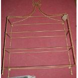 A gilt painted wirework four tier hanging wall shelf, having removable glass shelves, w.78cm