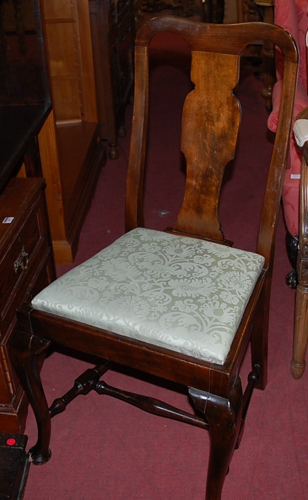 A set of six early 20th century walnut Queen Anne style splatback dining chairs, each having