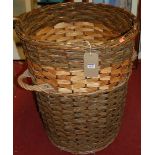 A wicker log basket of good size, height 73cm