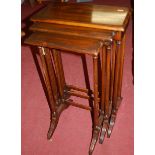 A contemporary mahogany nest of three occasional tables, the largest width 42cm