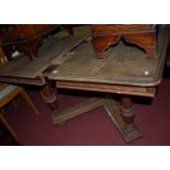 An early 20th century Belgian walnut round cornered extending dining table, having pull-out