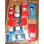 One tray containing a quantity of 1/24 and 1/18 scale diecasts to include a Bburago and others,