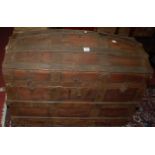 A circa 1900 stained wood and metal bound domed hinged top travelling trunk, w.81cm