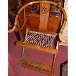 An Indonesian teak and brass mounted splatback horseshoe shaped X-framed throne chair, w.77cm