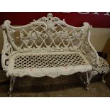A Victorian style white painted pierced and cast metal two-seater garden bench, width 104cm,