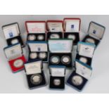 Great Britain, a collection of twelve cased silver proof coins and coin sets, to include 1995 50p