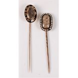 Two late 19th century mourning stick pins: an oval stick pin with glazed panel with plaited hairwork