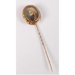 A painted stick pin an Ottoman style gentleman, the oval portrait of a gentleman in large striped