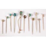 Eleven gemset stick pins: to include a 15ct Arts & Crafts style turquoise cabochon stick pin, 8mm