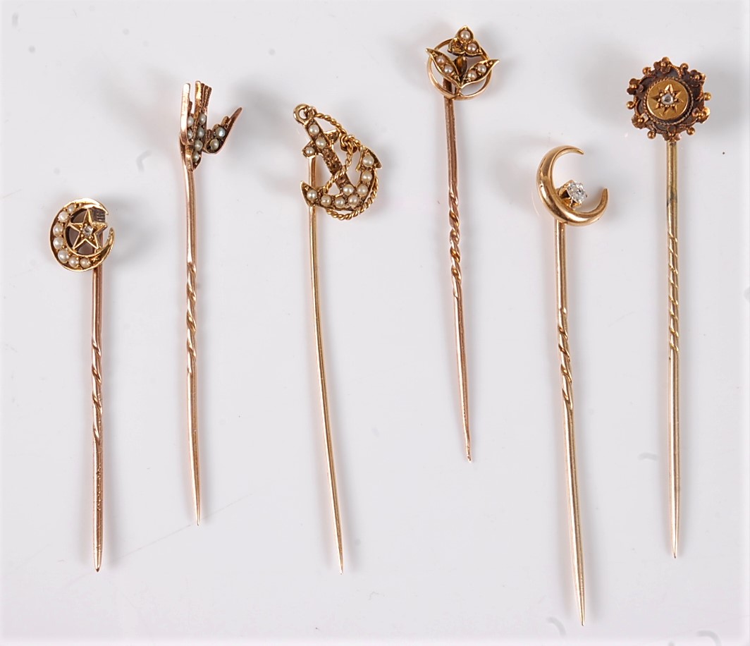 S ix diamond and seed pearl stick pins: a 15ct diamond and seed pearl crescent stick pin, 9.5mm