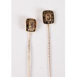 Two 19th century mourning stick pins: a mourning stick pin with central glazed panel with repoussé