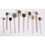 Ten various stick pins: to include garnet, diamond, seed pearl, enamel, and agate, (14.6g gross), (