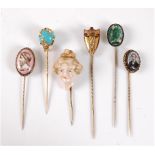Six various stick pins: to include a stick pin of a 3-dimensional ceramic bust of a lady, 22mm wide;