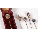 Five stick pins: a pietra dura stick pin, the oval panel collet mounted with rope twist border,
