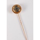 A Rifle Brigade reverse painted intaglio stick pin: the painted intaglio insignia collet mounted