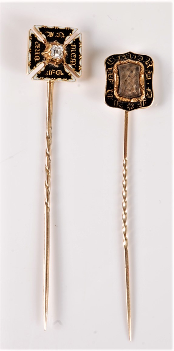 Two 19th century mourning stick pins: a diamond set Maltese cross stick pin, the central old mine
