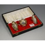 An Elizabeth II silver three piece cruet, to include mustard, pedestal salt and pepper by Mappin &