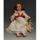 A mid-20th century Armand Marseille bisque head doll, having rolling blue eyes, with open mouth