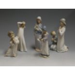 A Lladro figure group of a young girl and boy in prayer, printed mark verso, h.23cm; together with