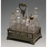 A Victorian silver plated seven bottle cruet stand