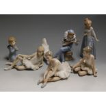 A set of three Nao Spanish porcelain figures of ballerinas, each in seated pose; together with a Nao